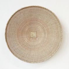 a woven basket is shown against a white background with an empty square in the center