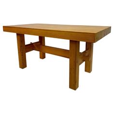 a wooden table with one leg extended