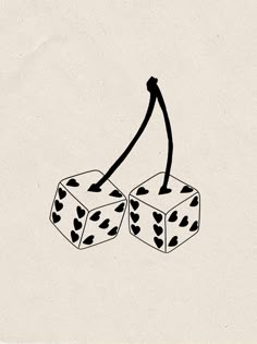 two dices with hearts drawn on them and one has a stick sticking out of it