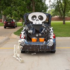 the trunk of a car decorated with skeleton decorations