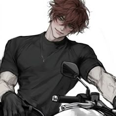 a man with red hair sitting on a motorcycle