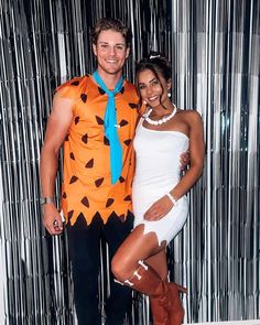 a man and woman dressed up in costumes