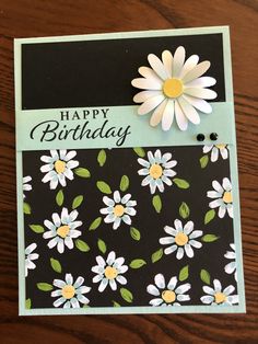 a card with flowers on it and the words happy birthday written in black, white, and yellow