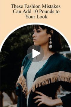 a woman with her hands on her hips, wearing a shawl and looking off to the side