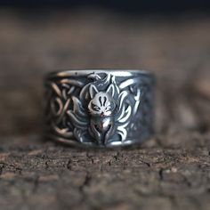 Introducing the enchanting allure of our Cute Gothic Nine-Tail Fox Kitsune Stainless Steel Ring - a captivating piece designed for the bold and mystical. Crafted with intricate detailing, this ring features the mythical nine-tail fox, known as Kitsune, a symbol of intelligence and magical prowess in Japanese folklore. Made from durable stainless steel, this accessory seamlessly blends cuteness with gothic charm, creating a unique and enchanting addition to your collection. With its delicate yet Wolf Design Ring Jewelry Gift, Wolf Design Ring Jewelry For Gift, Silver Wolf Design Ring As Gift, Ring Magic, Gothic Mode, Dark Rings, Mystical Animals, Animal Ring, Charm Ring