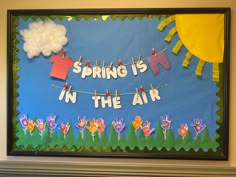 a bulletin board that says spring is in the air