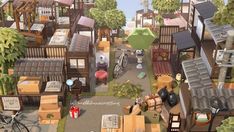 an aerial view of a city with lots of wooden buildings and various items on the ground