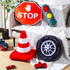 a red stop sign sitting on top of a white couch next to a toy car