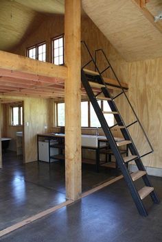 a ladder is in the middle of an unfinished room