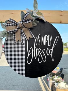 a black and white sign that says simply dressed