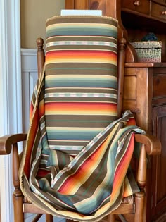 a chair with a blanket on top of it