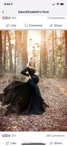 a woman in a black dress is posing for the camera with her hands on her hips