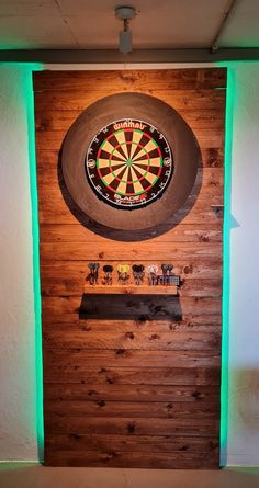 a dart board mounted to the side of a wooden wall