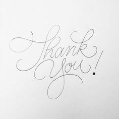 the word thank you written in cursive writing on a piece of white paper