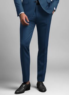 Pants are every gentleman's armor and the machismo of blue pants cannot be ignored. Crafted from pure wool, our Scabal Prussian Blue Wool Pants are a staple timeless piece every man needs in his wardrobe. Ideal for the boardroom, the altar, or any other nerve-jangling situation you might find yourself in. Achieve this professional look by teaming it up with matching waistcoat and trousers, a white formal shirt, tie and polished black shoes.  Look Includes  Scabal Prussian Blue Wool Fabric  Cross Pocket  Flat Front  Two Welted Back Pockets on Trousers   Click 'Customize Now' to modify the look if needed.  Lining: Viscose, Dry Clean. Blue Formal Trousers Suit, Formal Blue Wool Bottoms, Elegant Blue Wool Bottoms, Blue Wool Bottoms With Welt Pockets, Tailored Blue Wool Bottoms, Tailored Wool Blue Bottoms, Classic Blue Suits With Trousers, Fitted Blue Wool Dress Pants, Fitted Wool Blue Dress Pants