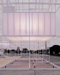 an empty parking lot with lots of white scaffolding