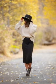 The midi skirt that should be in every closet. The perfect versatile piece to dress... Business Casual Boho Outfits, Black Skirt Cream Sweater, Elegant Feminine Style Work Outfits, Aline Skirt Outfit Winter, Black Skirt With Black Tights, Tznius Fashion Winter, 30s Women Outfits, Shoes For Pencil Skirt, Styling A Long Black Skirt