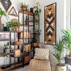 a living room filled with lots of plants and books