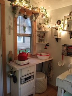 a kitchen area with a sink, stove and window