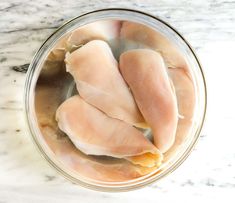 overhead view of raw chicken breast in a bowl with water and salt Boneless Chicken Breast Recipe, Baked Boneless Chicken, Baked Boneless Chicken Breast, Perfect Baked Chicken Breast, Brine Chicken Breast, Feta Stuffed Chicken Breast, Perfect Baked Chicken