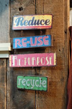 there are many signs on the wall that say reduce, reuse, repurpoise and recycle