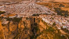 an aerial view of a city on the edge of a cliff