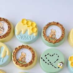 there are many winnie the pooh cupcakes on this table