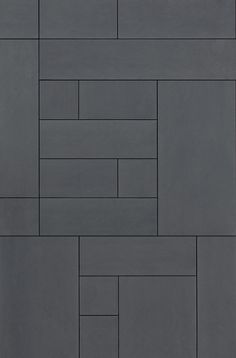 an image of a tile wall that looks like it is made out of grey bricks