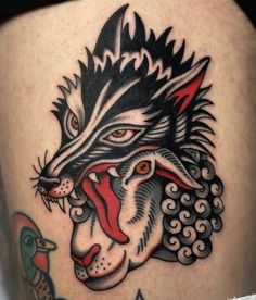 a close up of a person's thigh with a tattoo on it and an animal