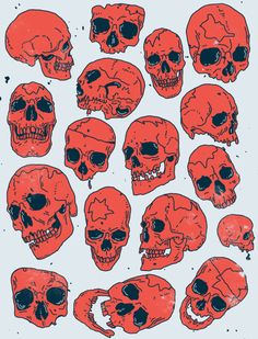 a bunch of skulls that are red and black