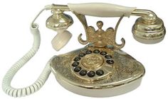 an old fashioned phone with two bells on the front and one cord attached to it