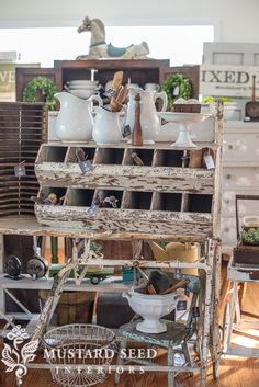 an old wooden cart filled with pots and pans