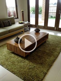 a living room with couches, coffee table and sliding glass doors