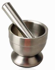 a metal cup with a spoon in it