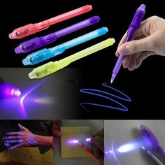 four different types of light up pens in various shapes and sizes, with one being held by