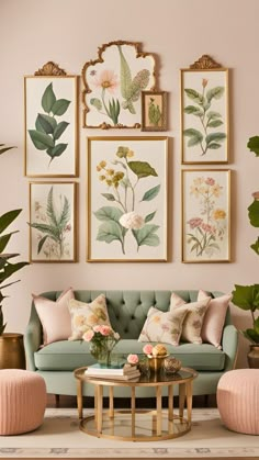 a living room filled with furniture and framed pictures on the wall above it's coffee table