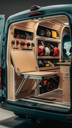 A compact gear wall with flip table designs and space-saving storage in a small van. Campervan Interior Ideas, Vw T5 Campervan, Flip Table, Luxury Rv Living, Kangoo Camper, Mercedes Camper, Gear Wall, Van Storage