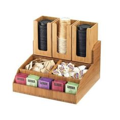 a wooden box filled with lots of different types of food and drink items on top of each other