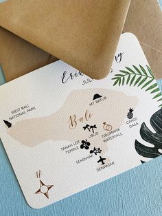 the wedding stationery is laid out on top of each other, with matching envelopes