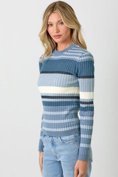 Meg Striped Sweater Indulge in luxury with our Meg Striped Sweater. Featuring a stylish color block design with blue and grey stripes, this sweater exudes sophistication and elegance. Made from premium materials, it offers both comfort and style, making it the perfect addition to your wardrobe. Elevate your fashion game with Meg.