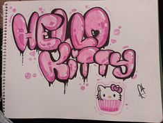 a drawing of hello kitty with the words hello kitty written in pink and black ink