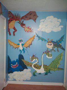 a child's room with blue walls and dragon murals