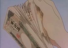 a hand is holding money in it's palm