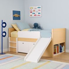 a child's bedroom with a slide in the corner