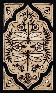 an intricately designed tile with dragonflies and flowers