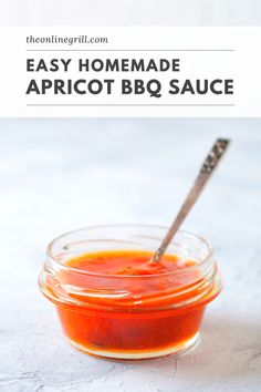 homemade apricot bbq sauce in a small glass jar with a spoon inside