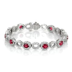 Eleven oval shaped red rubies weighing 4.58 carats on a bracelet.These rubies are from Mozambique and has a mixed brilliant cut and vivid color intenisty.Also featured in the bracelet are 242 round shaped white diamonds weighing 3.26 carats. #braceletfashion #fallbracelets #amazingjewelry #iloveyourbracelet #diyjewelryideas Red Oval Diamond Bracelet, Red Diamond Oval Bracelet, Elegant Red Bracelets With Brilliant Cut, Luxury Red Oval Bracelet, Red Diamond Oval Tennis Bracelet, Red Oval Diamond Gemstone Bracelet, Elegant Red Oval Diamond Bracelet, Oval Ruby Diamond Bracelet, Red Oval Fine Jewelry Tennis Bracelet