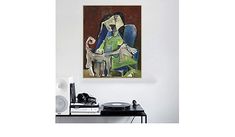 a painting hanging on the wall above a record player