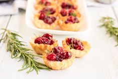 small cranberry tarts with rosemary sprigs on the side