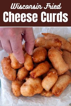 a person picking up some fried cheese curls from a paper bag with the words wisconsin fried cheese curls on it